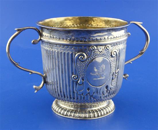 A William III Britannia standard silver porringer by John Fawdery, gross 15 oz.